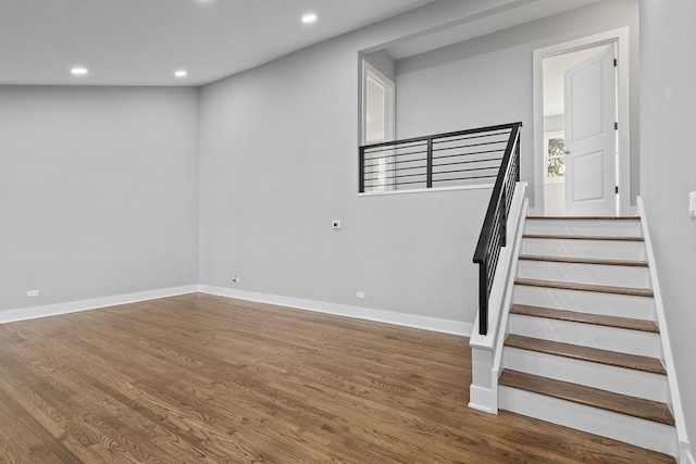 staircase featuring hardwood / wood-style floors