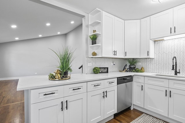 kitchen with dishwasher, sink, kitchen peninsula, decorative backsplash, and white cabinetry