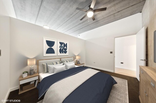 bedroom with ceiling fan and dark carpet