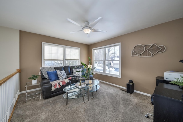 carpeted living room featuring ceiling fan