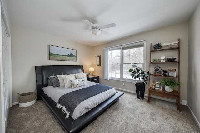 carpeted bedroom with a closet and ceiling fan