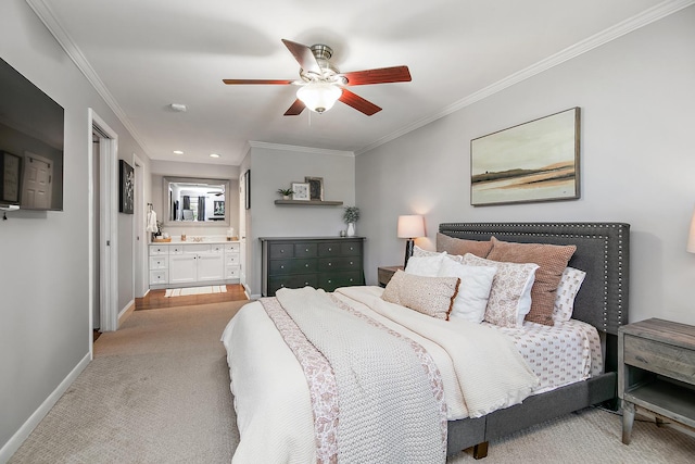 carpeted bedroom with ensuite bathroom, ceiling fan, and ornamental molding