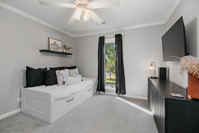 bedroom with light colored carpet, ceiling fan, and crown molding