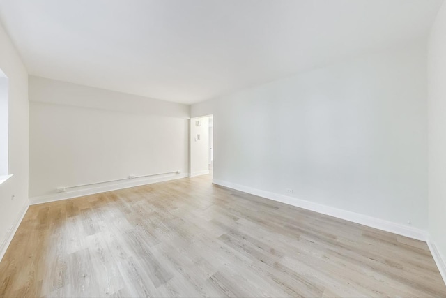 spare room with light wood-type flooring