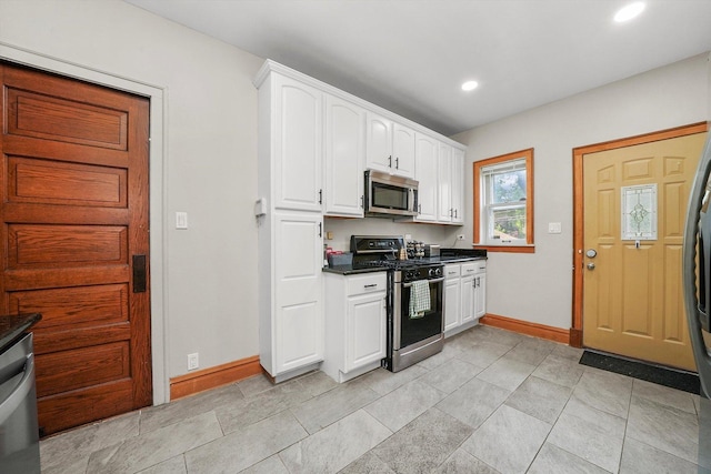 kitchen featuring white cabinetry and stainless steel appliances