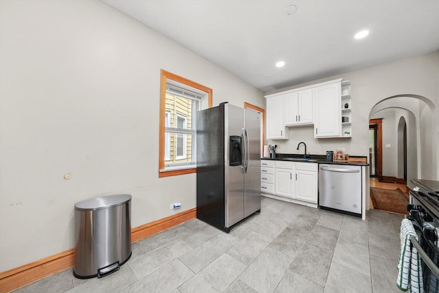 kitchen featuring sink, white cabinets, and appliances with stainless steel finishes