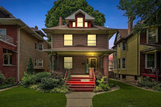 view of front of home featuring a yard and a porch