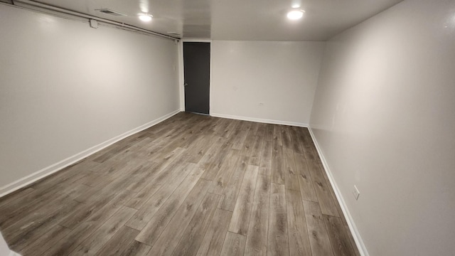 spare room featuring light hardwood / wood-style flooring