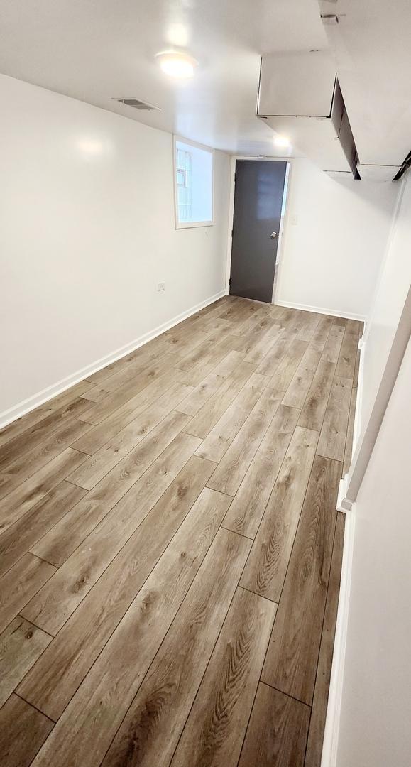 basement with light wood-type flooring