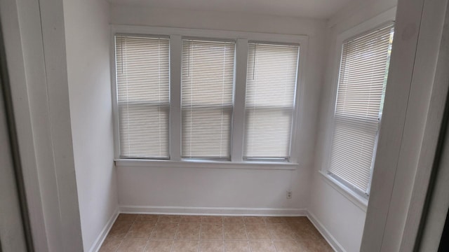 empty room with light tile patterned flooring