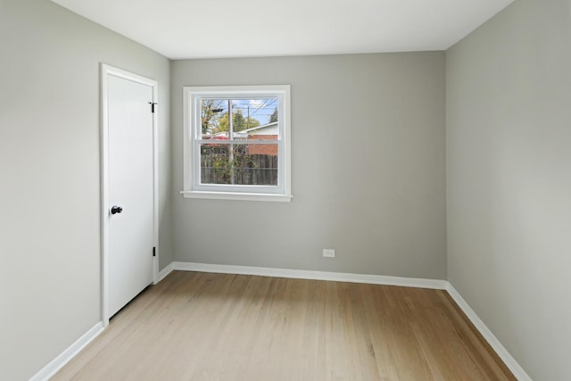 spare room featuring light hardwood / wood-style flooring