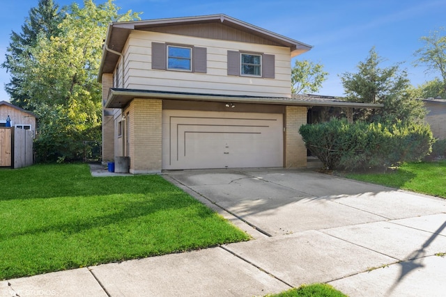 view of front property featuring a garage and a front lawn