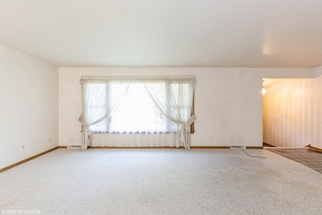 unfurnished room featuring carpet