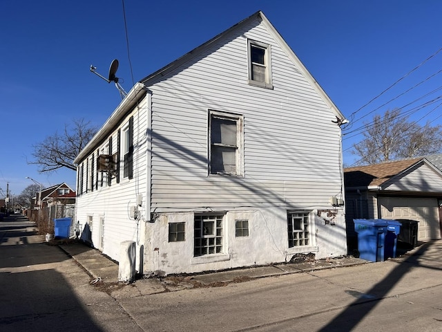 view of property exterior with a garage