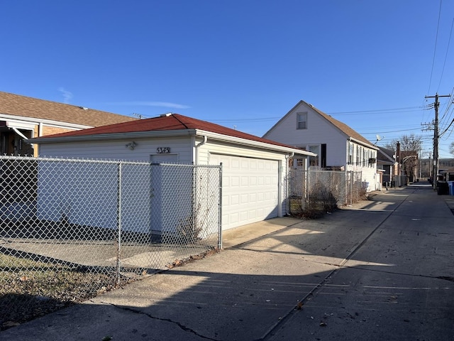 view of property exterior featuring an outbuilding and a garage