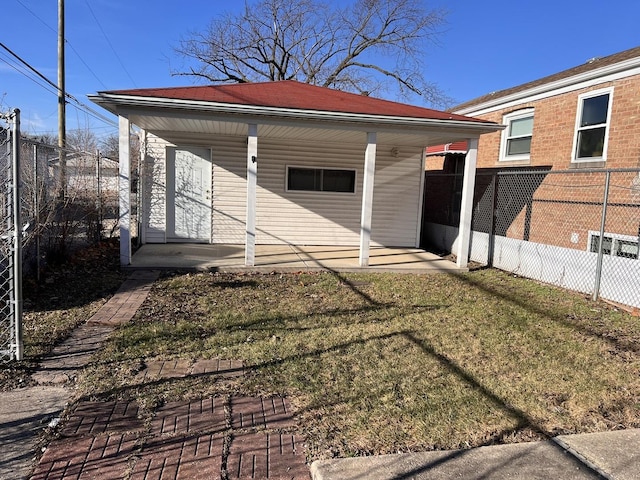 view of outbuilding with a yard and a carport