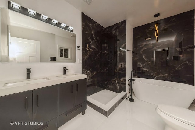 bathroom featuring toilet, vanity, and tiled shower