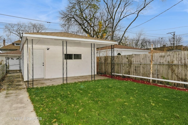 view of outbuilding featuring a lawn