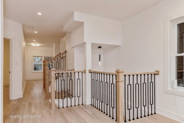 hall with light hardwood / wood-style floors