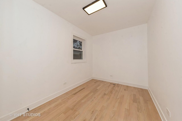 spare room with light wood-type flooring