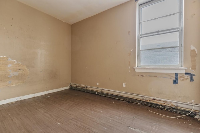 empty room featuring wood-type flooring