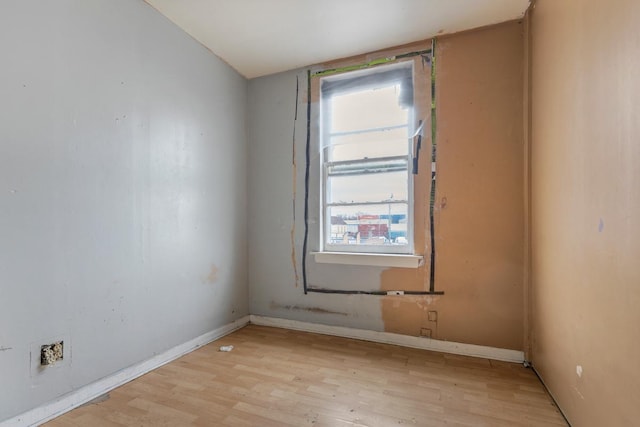 spare room featuring light wood-type flooring