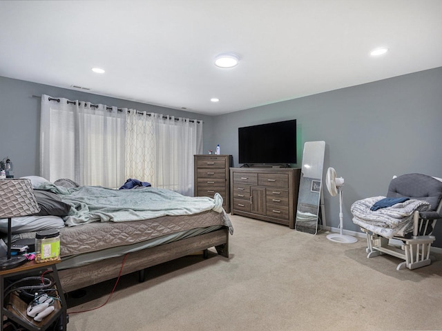 bedroom with light colored carpet