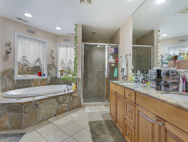 bathroom with vanity and independent shower and bath