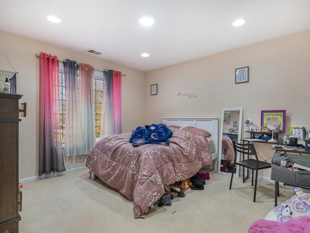 bedroom with light colored carpet