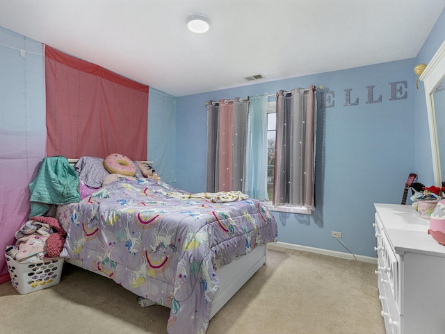 bedroom with light colored carpet