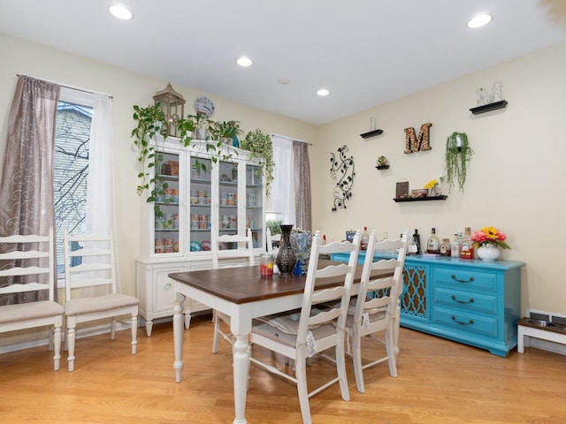 dining space with light wood-type flooring