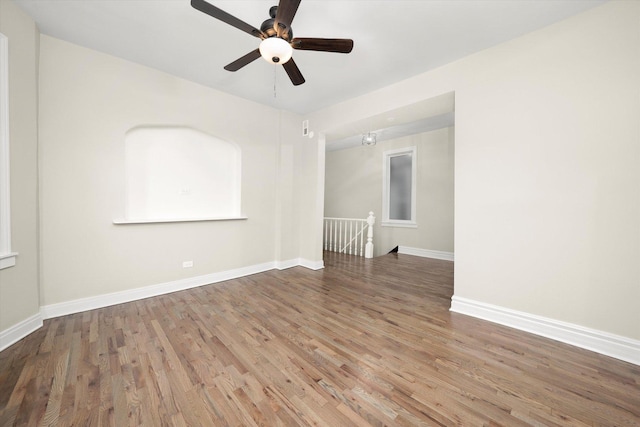 empty room with ceiling fan and wood-type flooring