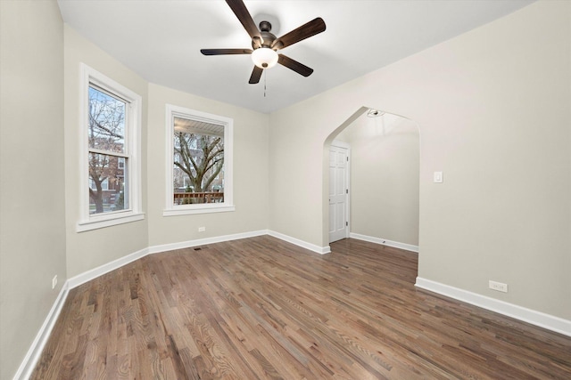 unfurnished room featuring hardwood / wood-style floors and ceiling fan