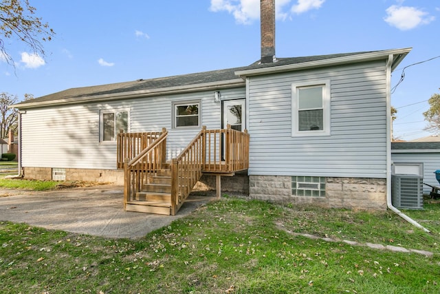 back of house with a yard, a patio, and central AC unit