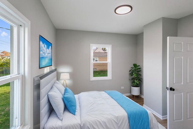 bedroom with dark wood-type flooring