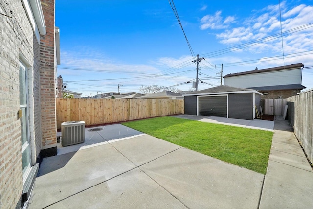 view of yard with cooling unit, an outdoor structure, and a patio