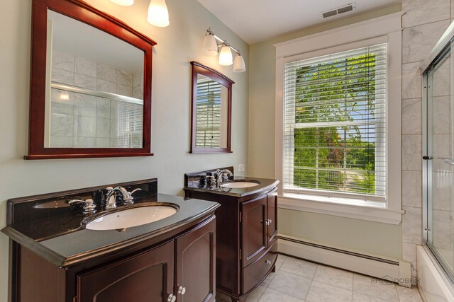 bedroom with hardwood / wood-style flooring, ceiling fan, radiator heating unit, and ensuite bathroom