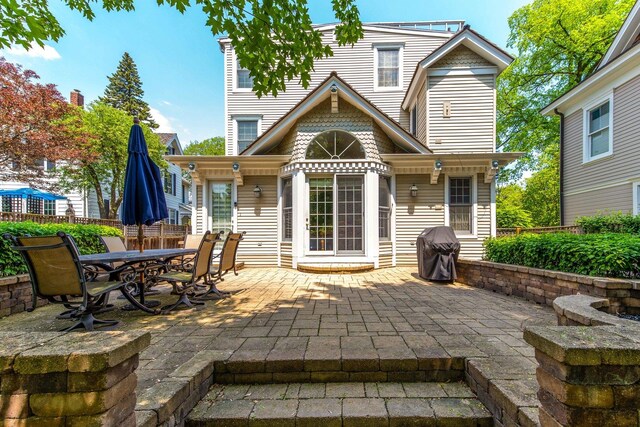 view of patio / terrace with a garage and an outdoor structure