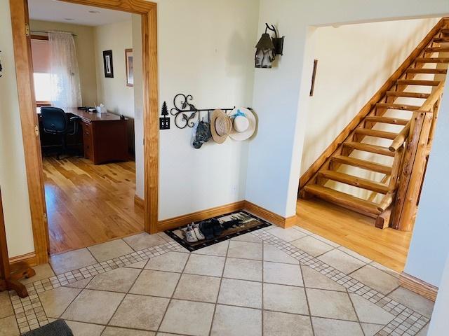 foyer featuring light tile patterned floors