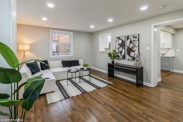 living room with dark hardwood / wood-style flooring