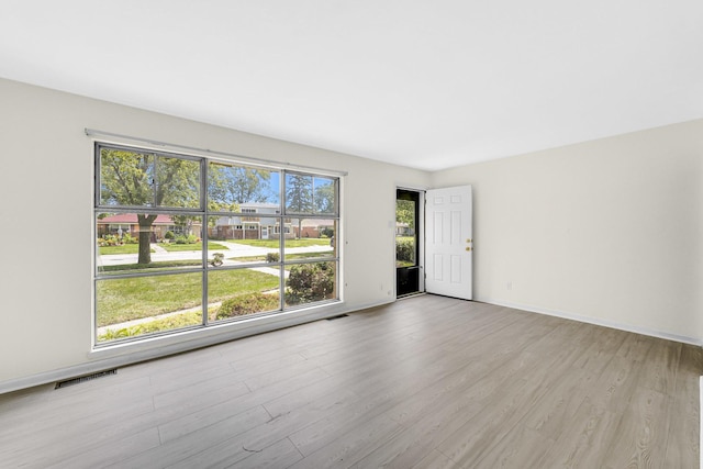 empty room with light wood-type flooring