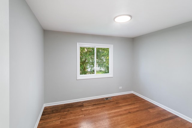 empty room featuring hardwood / wood-style flooring