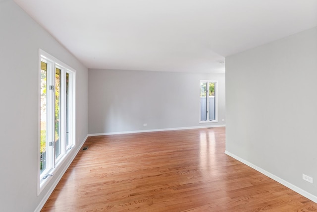 spare room with light hardwood / wood-style flooring