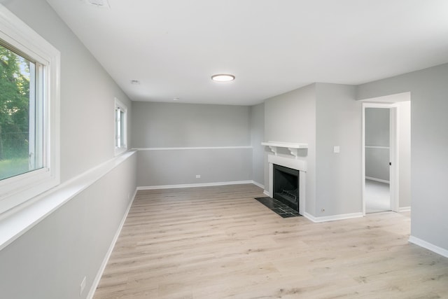 unfurnished living room featuring light hardwood / wood-style flooring