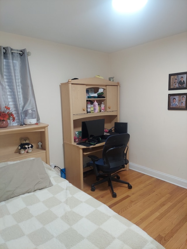 bedroom with wood-type flooring