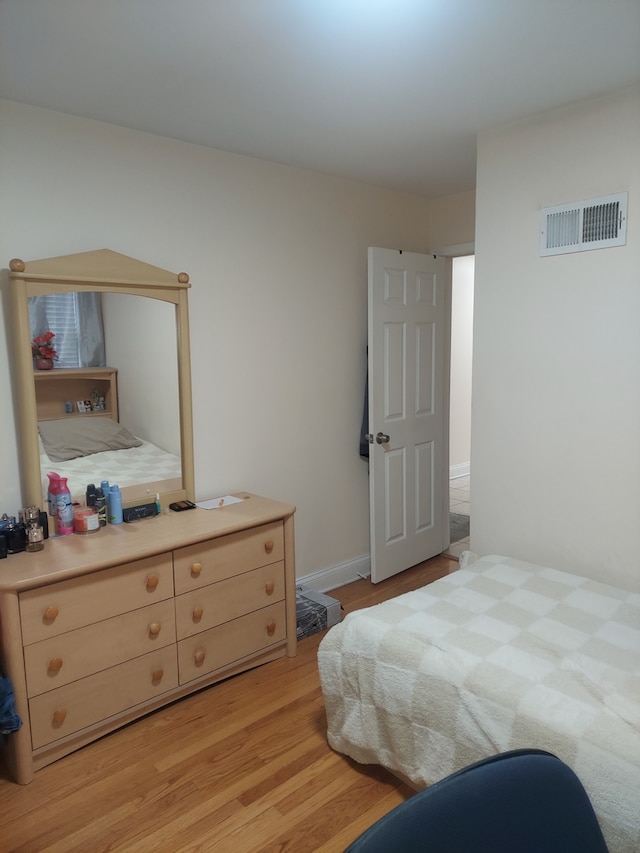 bedroom featuring light hardwood / wood-style floors