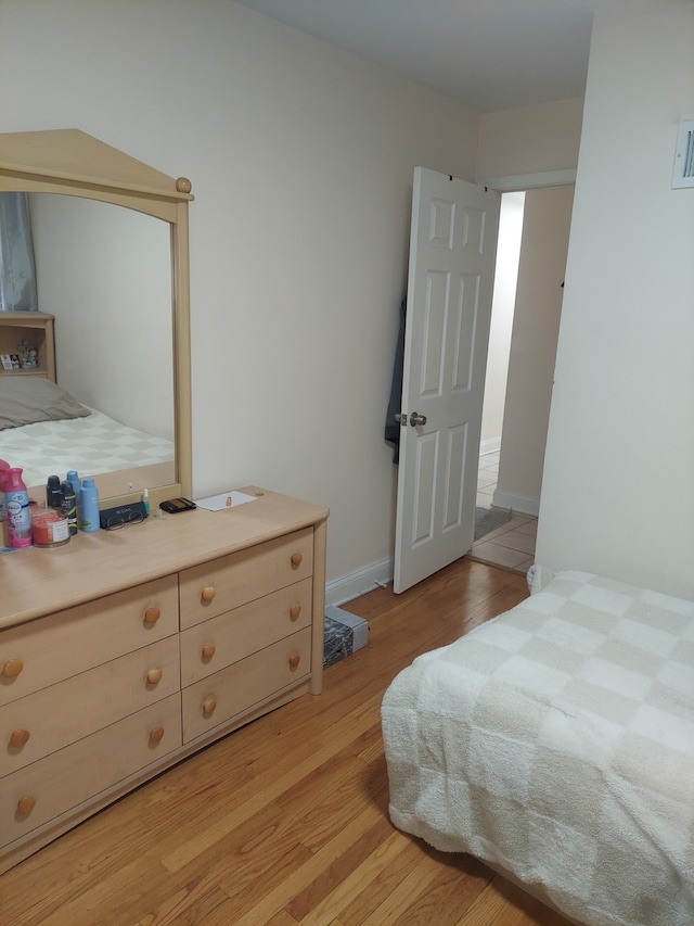 bedroom with light hardwood / wood-style floors