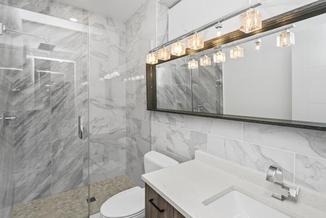 bathroom featuring decorative backsplash, an enclosed shower, vanity, tile walls, and toilet