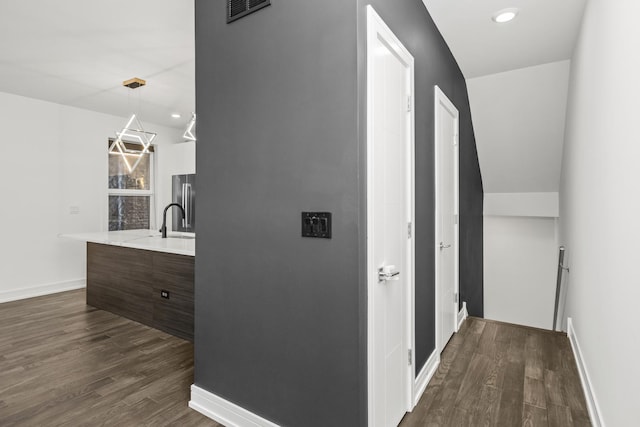 hallway featuring dark wood-type flooring