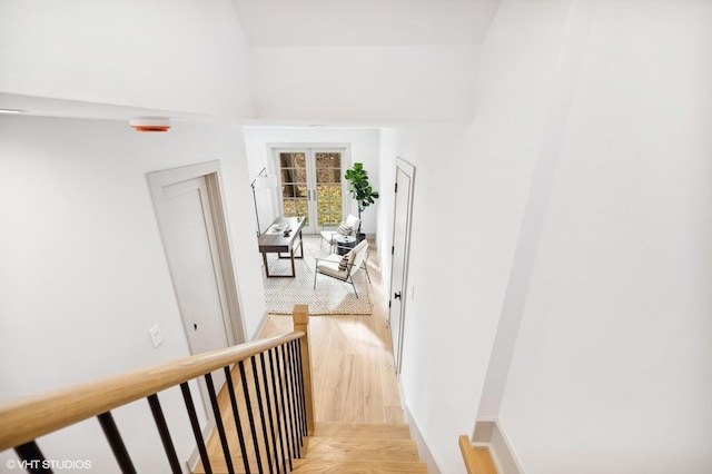 corridor with hardwood / wood-style floors